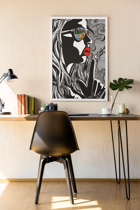 Modern workspace with black chair, wooden desk, and colorful abstract woman art with sunglasses reflection