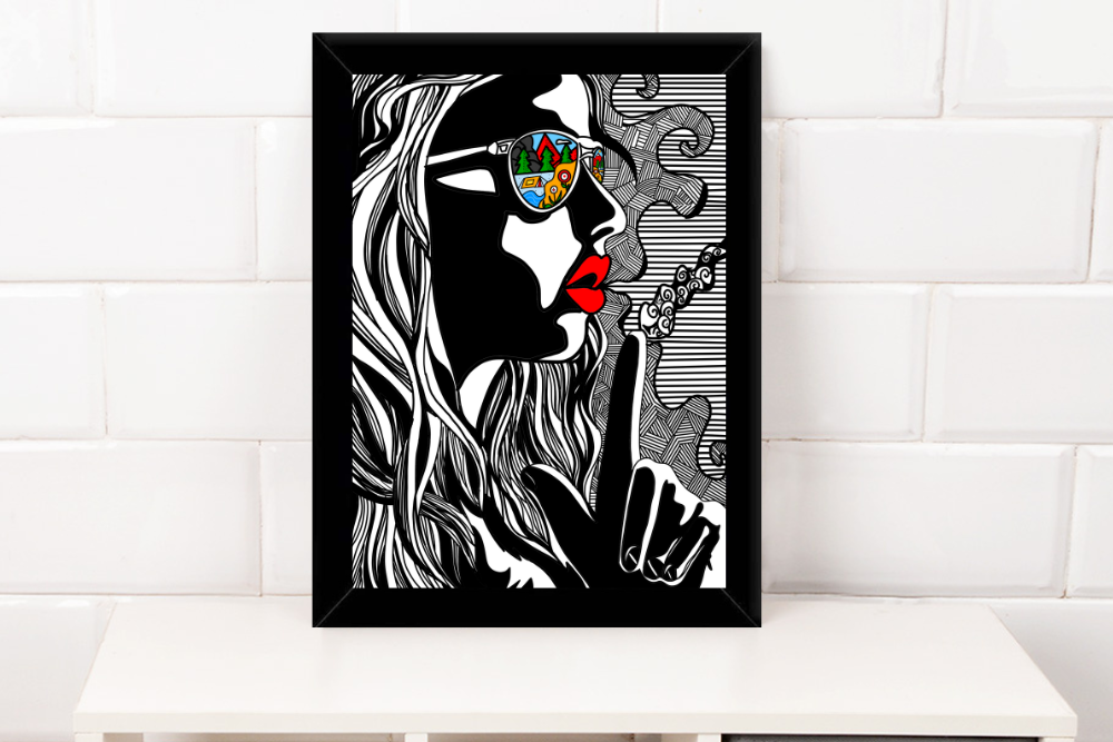 Black and white framed artwork of woman with red lips wearing sunglasses reflecting colorful outdoor scene