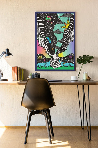 Modern workspace with black chair, wooden desk, lamp, books, camera, plant, and colorful astronaut space art